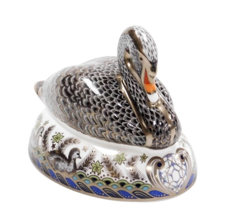 A Royal Crown Derby Platinum Black Swan porcelain paperweight, to celebrate the 60th anniversary of the coronation of H.M. Queen Elizabeth II 1953-2013, limited edition number 337/600, with gold stopper and red printed marks to underside, 14cm wide, boxed