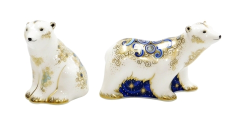 Two Royal Crown Derby Polar Bear Cubs porcelain paperweights, Alice and Boris, designed by Jane James for Connaught House, signature edition of 38/950, with gold stoppers and red printed marks to underside, the seated bear 8cm high the standing bear 7cm h