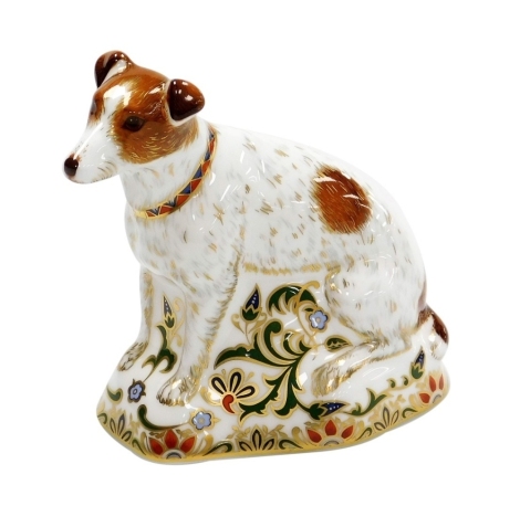 A Royal Crown Derby Jackie porcelain paperweight, a limited edition number 50/300 pre release exclusive to Roberts China, Crystal & Silver USA, designed by Sue Rowe, with gold stopper, signed Sue Rowe with gold printed marks to underside, 12cm wide, boxed