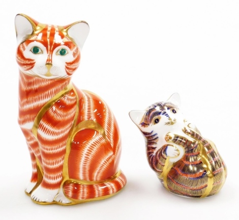 Two Royal Crown Derby cat porcelain paperweights, ginger tomcat, with gold stopper and red printed marks to underside, 13cm high, and recumbent kitten, with gold stopper and red printed marks to underside, 6cm high. (kitten boxed)