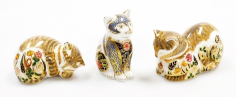 Three Royal Crown Derby kitten paperweights, comprising Lavender, a signature edition of 1500 for Goviers of Sidmouth designed by Sue Rowe, with gold stopper and red printed marks to underside, 9cm wide, boxed, Fireside Kitten, specially commissioned by P