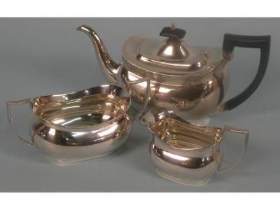 An associated three piece silver tea service