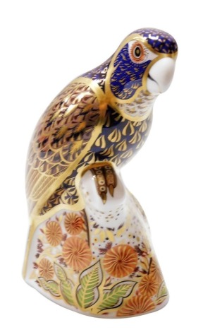 A Royal Crown Derby Bronze Winged Parrot porcelain paperweight, with gold stopper and red printed marks to underside, 16cm high, boxed.