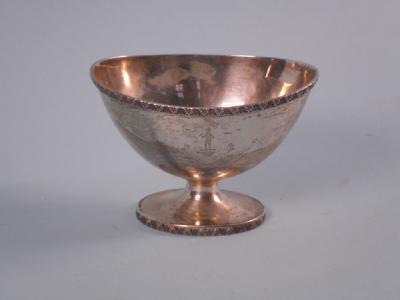 An oval silver sugar bowl with foliate border