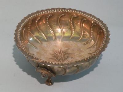 A Victorian silver sugar bowl embossed with beads and scrolls