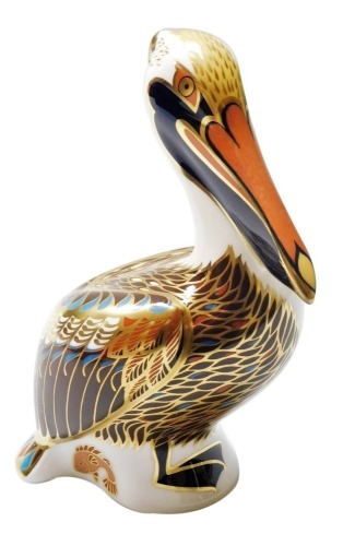 A Royal Crown Derby Brown Pelican porcelain paperweight, with gold stopper and red printed marks to underside, 13cm high, boxed.