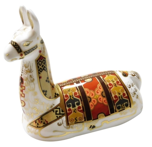 A Royal Crown Derby Llama porcelain paperweight, an exclusive for The Royal Crown Derby Collectors Guild, with gold stopper and gold printed marks to underside, 15cm wide, boxed.