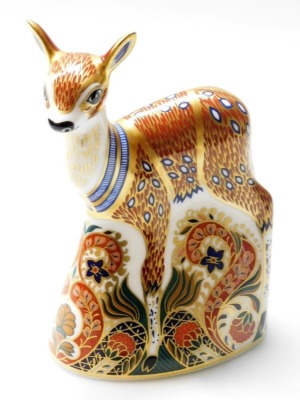 A Royal Crown Derby Fawn paperweight, exclusive for The Royal Crown Derby Collectors Guild, with gold stopper and red printed marks to underside, 14cm high, boxed.