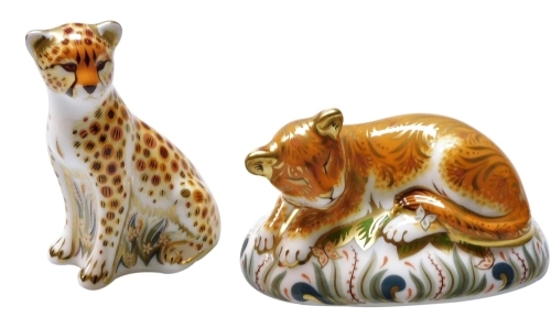 Two Royal Crown Derby porcelain paperweights, Cheetah Cub, 8cm high, and Sleepy Lion Cub, 9cm high, exclusively commissioned by Goviers of Sidmouth, limited edition 515/950, with gold stoppers, boxed with certificates.