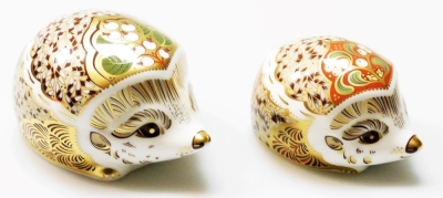 Two Royal Crown Derby Christmas hedgehogs porcelain paperweights, Snowberry large Christmas hedgehog, limited edition 488/1500, 11cm wide, and Mistletoe medium Christmas hedgehog, limited edition 488/1500, 8cm wide, both commissioned by Goviers of Sidmout