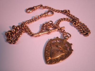 A 9ct gold Albert with attached fob and swivels