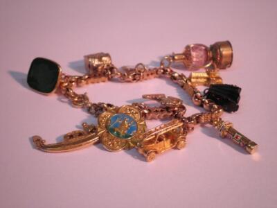 A converted watch chain bracelet with 11 attached charms