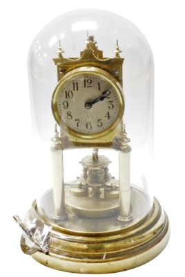 A 20thC Gustav Becker brass anniversary clock, with a glass dome, with key, 27cm high overall.