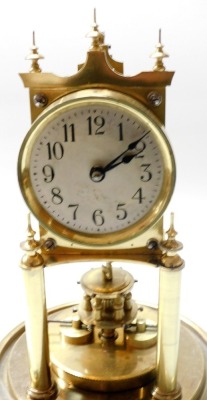 A 20thC Gustav Becker brass anniversary clock, with a glass dome, with key, 27cm high overall. - 2