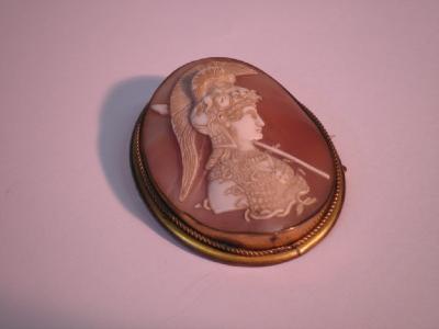 A finely carved shell cameo in a plated frame