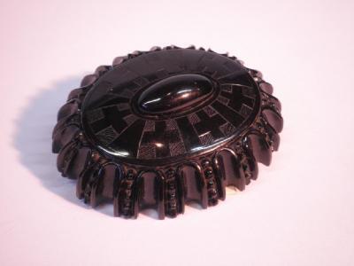 A Victorian carved jet brooch