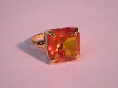 An amber coloured stone set ring