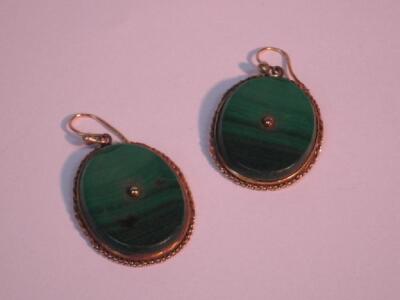 A pair of malachite and tiny diamond set ear rings in yellow metal frames.<br