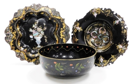 A Victorian papier mache and mother of pearl wall plate, of circular form with shaped outline, decorated with urns and scrolls with gilt highlights, 27cm wide, a pulpware Thetford bowl of circular form, and a further papier mache plate. (3)