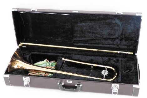 A Yamaha trombone, in a fitted case.