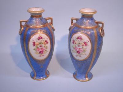 A pair of Noritake two handled porcelain vases