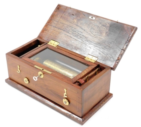 A musical box, with a brass cylinder and steel comb, in later associated hardwood case (AF), 34cm wide.