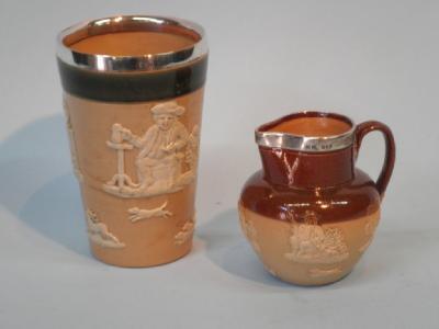 A Royal Doulton stoneware jug with a silver mount and a similar Doulton