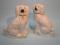 A pair of late Staffordshire flatback spaniels with gilt decoration