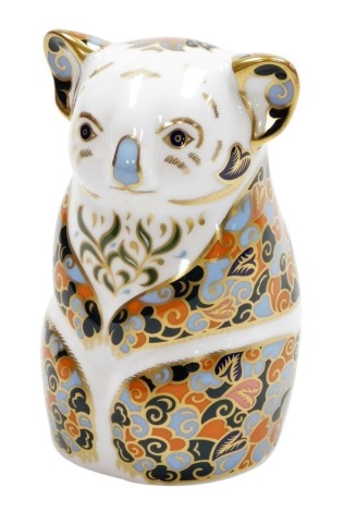 A Royal Crown Derby Queensland Koala porcelain paperweight, part of the Endangered Species series for Sinclairs, limited edition number 375/1000, with gold stopper and red printed marks to underside, 11cm high, boxed with certificate.