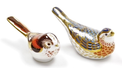 Two Royal Crown Derby bird porcelain paperweights, Long Tailed Tit, 13cm wide, and Pied Tail Blue Bird, 13cm wide, both with gold stoppers and red printed marks to underside, boxed.