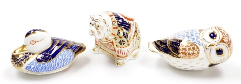 Three Royal Crown Derby porcelain paperweights, duck, 12cm wide, owl, signed to base Hugh Gibson, 14cm wide, and bulldog, 8cm high, all with gold stoppers and red printed marks to underside, with associated boxes.