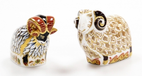 Two Royal Crown Derby ram porcelain paperweights, Kedlestone Ram, 12cm wide, and Derby Ram, exclusively available from The Royal Crown Derby Visitors Centre, 10cm wide, both with gold stoppers and red printed marks to underside, boxed.