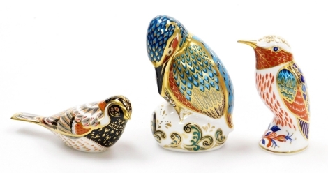 Three Royal Crown Derby bird porcelain paperweights, humming bird, 10cm high, Kedlestone Kingfisher, 11cm high, and Bunting, 13cm wide, all with gold stoppers and red printed marks to underside, boxed.