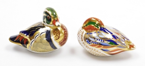 Two Royal Crown Derby bird paperweights, Carolina Duck, 13cm wide, and Teal, 12cm wide, both with gold stoppers and red printed marks to underside, boxed.