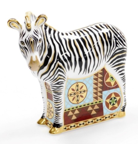 A Royal Crown Derby Zebra porcelain paperweight, with gold stopper and red printed marks to underside, 16cm high, boxed with certificate.