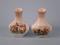 A pair of Royal Worcester Palissy bottle shaped vases each printed with hunting scenes