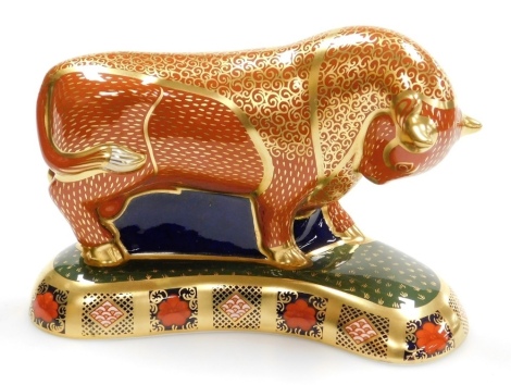 A Royal Crown Derby Harrods Bull porcelain paperweight, Specially Commissioned by Harrods, limited edition number 234/400, with gold stopper and red printed marks to underside, 13cm high, boxed with certificate.