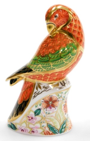 A Royal Crown Derby Lorikeet porcelain paperweight, limited edition number 589/2500, with gold stopper and red printed marks, 15cm high, boxed with certificate.