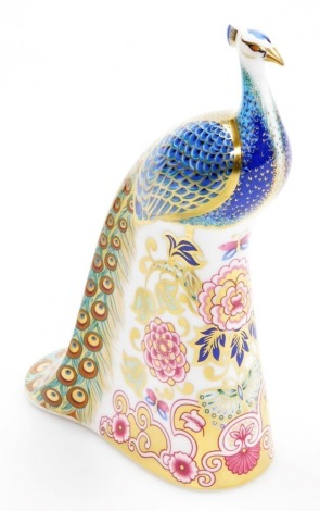 A Royal Crown Derby Designers' Choice Collection Derby Peacock porcelain paperweight, designed by Sue Rowe, Exclusive to the Visitors Centre, limited edition number 417/750, with gold stopper and red printed mark to underside, 17cm high, boxed with certif