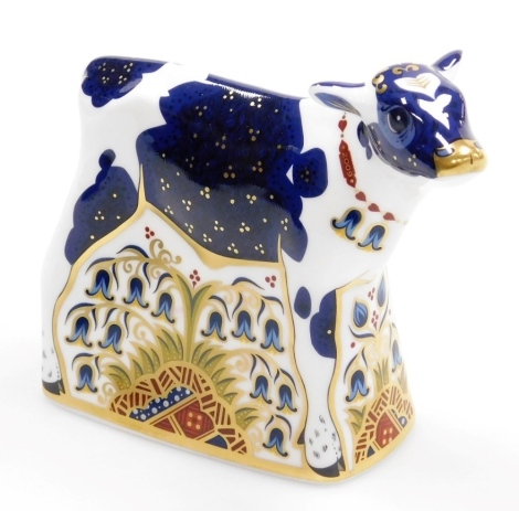 A Royal Crown Derby New Year Calf porcelain paperweight, limited edition number 277/1000, with gold stopper and red printed mark to underside, 12cm high, boxed, with certificate.