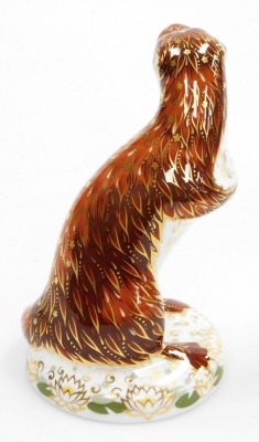 A Royal Crown Derby Playful Otter porcelain paperweight, with gold stopper and red printed marks to underside, 15cm high, boxed. - 2