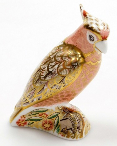 A Royal Crown Derby Cockatoo porcelain paperweight, limited edition number 981/2500, with gold stopper and red printed marks to underside, 13cm high, boxed with certificate.