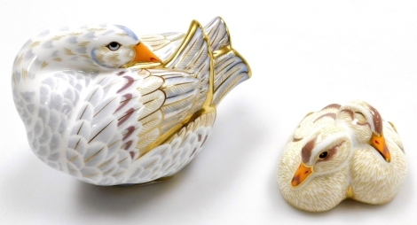 A Royal Crown Derby Designers Choice Collection Goose and Goslings porcelain paperweights, designed by Jane Branscombe the goose 14cm wide, the goslings 9cm wide, limited edition number 315/750, with gold stoppers and red printed marks to underside, boxed