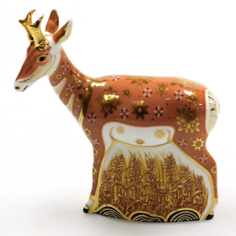 A Royal Crown Derby Pronghorn Antelope porcelain paperweight, limited edition number 112/950, with gold stopper and red printed marks to underside, 17cm high, boxed with certificate.