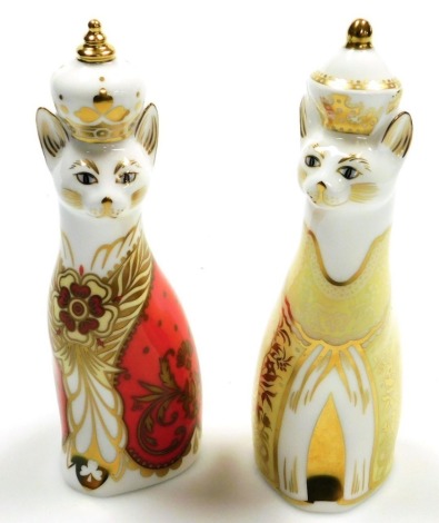 Two Royal Crown Derby Royal commemorative porcelain paperweights, Royal Cat Charlotte, limited edition number 117/450, and Royal Cat George, limited edition number 117/450, with gold stoppers and red printed marks to underside, 16cm high, both boxed.