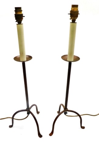 A pair of cast iron pricket style electric table lamps, 58cm high.