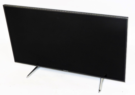 A Panasonic 39" flat screen television, with lead, lacking remote.