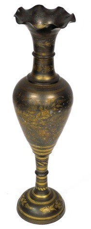 An Eastern floor standing vase, with a flared rim, the body decorated with etched brass decoration of flowers, leaves, etc., on a pedestal base, 90cm high.