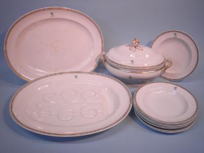 A Minton porcelain part dinner service with a lion crest