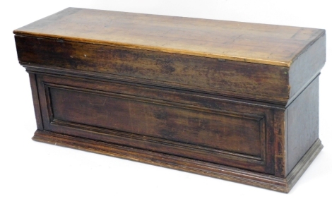 A pine and oak blanket chest, the front with a carved panel, on a plinth base, made from a variety of timbers from different ages, 45cm high, 108cm wide, 34cm deep.